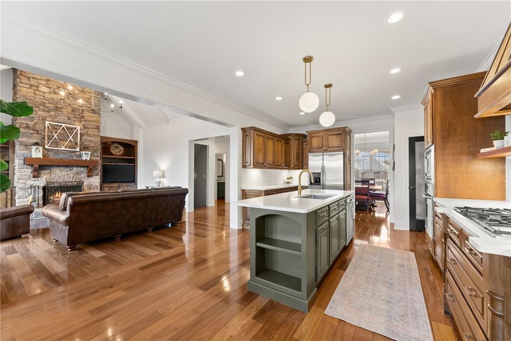 4529 Montclair Circle Gainesville, GA 30506 - Photo 5 of 35 a kitchen with stainless steel appliances granite countertop a stove and a refrigerator
