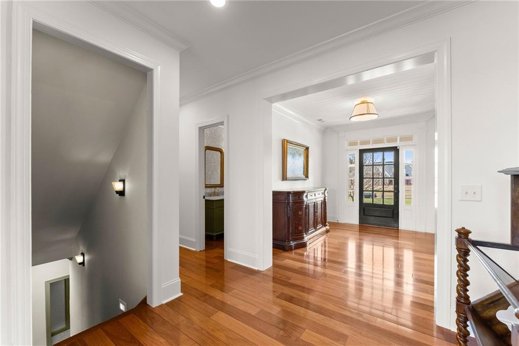 4529 Montclair Circle Gainesville, GA 30506 - Photo 8 of 35 a view of a hallway with wooden floor and dining room