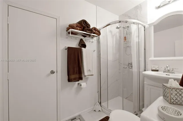 a bathroom with a shower and a mirror