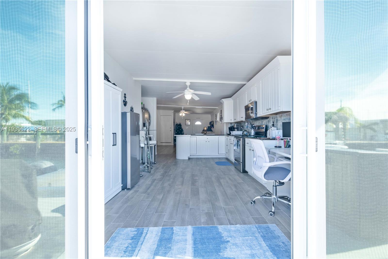 1361 Overseas Highway, Unit E11 Marathon, FL 33050 - Photo 18 of 29 a view of a kitchen from the hallway