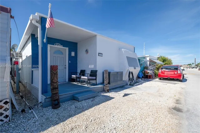 a bedroom with furniture and a flat screen tv