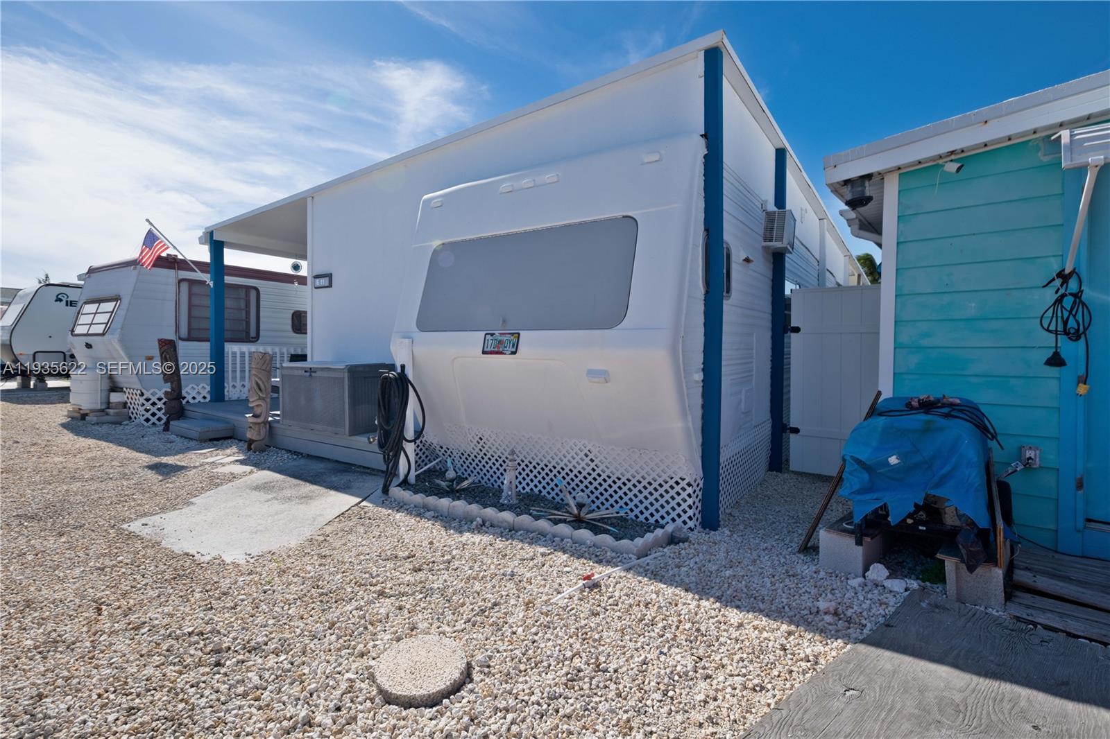 1361 Overseas Highway, Unit E11 Marathon, FL 33050 - Photo 24 of 29 a bed room with a bed