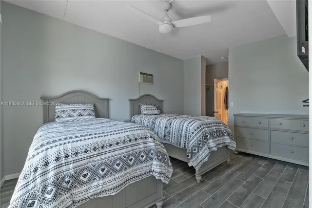 a bedroom with double bed and a window