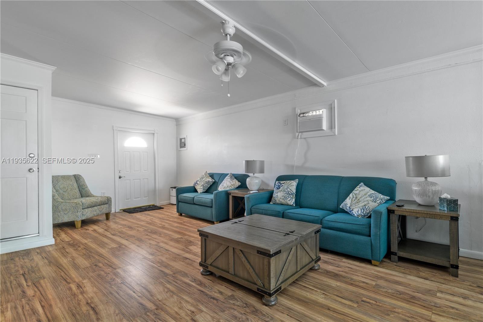 1361 Overseas Highway, Unit E11 Marathon, FL 33050 - Photo 4 of 29 a living room with furniture and a wooden floor