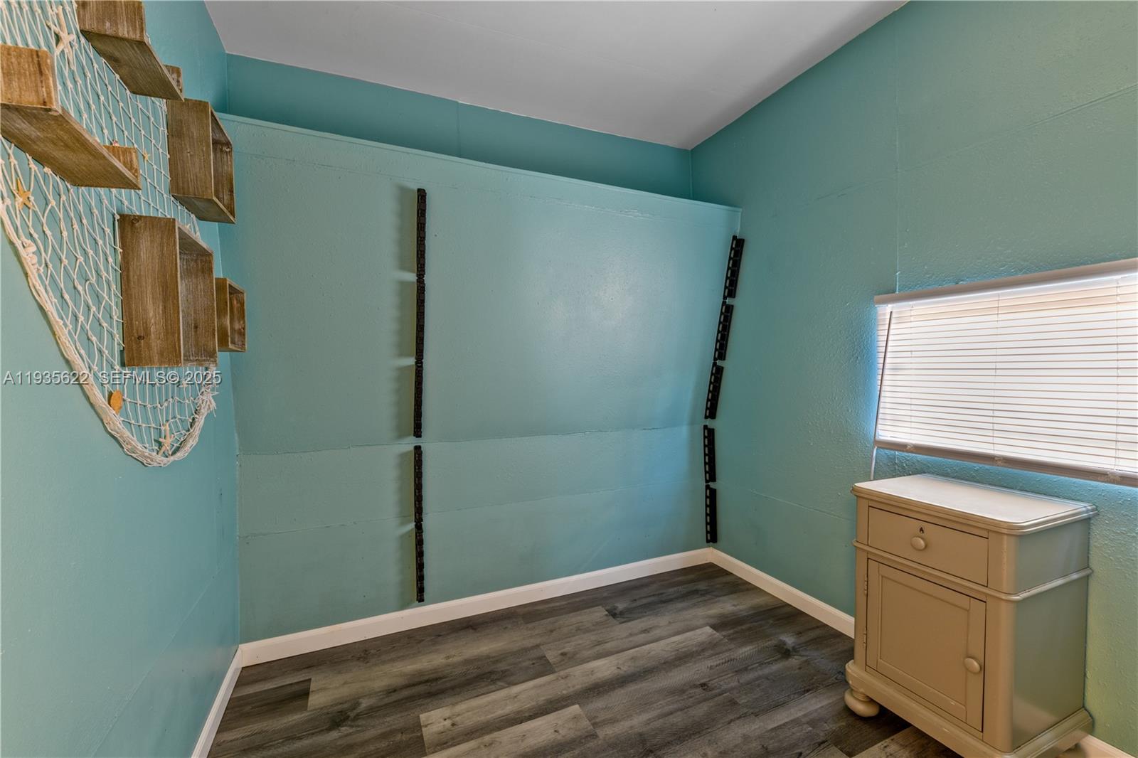 1361 Overseas Highway, Unit E11 Marathon, FL 33050 - Photo 6 of 29 a view of a room with racks on the wall