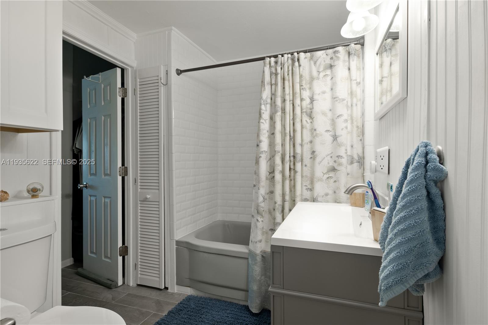 1361 Overseas Highway, Unit E11 Marathon, FL 33050 - Photo 8 of 29 a bathroom with a tub and shower