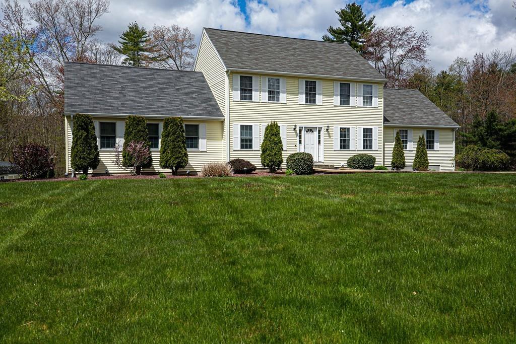 98 Haggerty Road Charlton, MA 01507 - Photo 1 of 42 a front view of a house with a garden