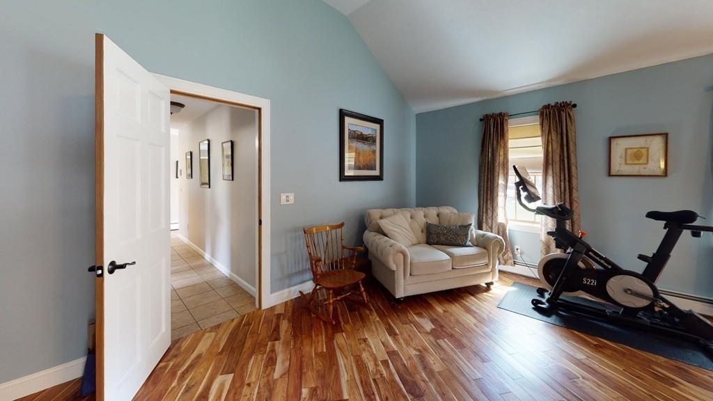 98 Haggerty Road Charlton, MA 01507 - Photo 17 of 42 a living room with furniture and a wooden floor