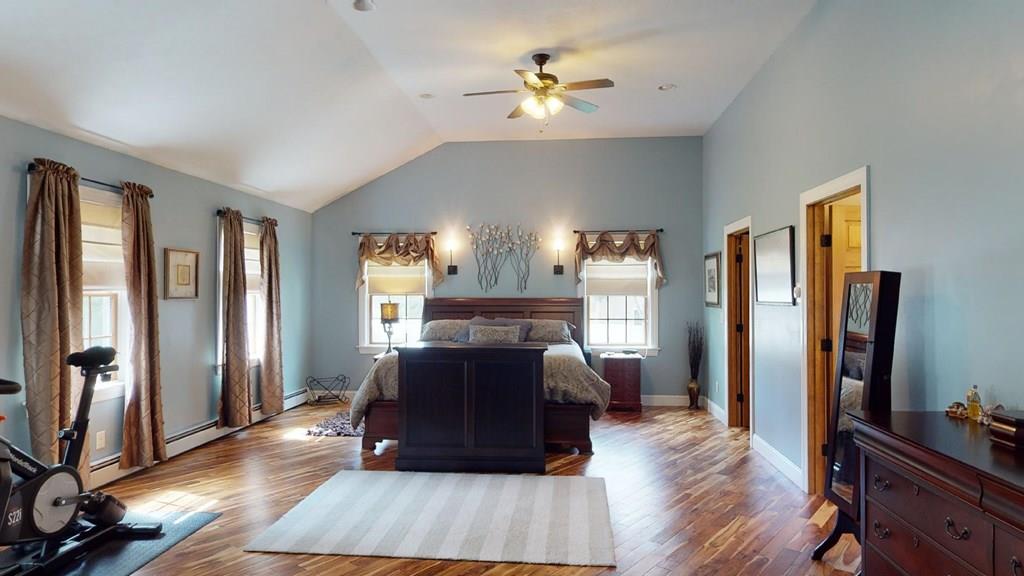 98 Haggerty Road Charlton, MA 01507 - Photo 18 of 42 a living room with a bed furniture and a flat tv screen