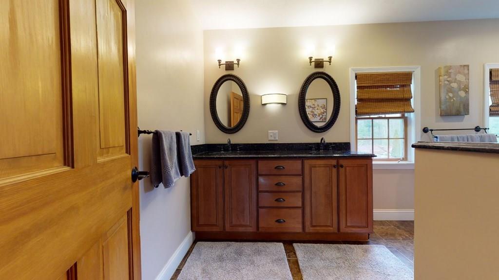 98 Haggerty Road Charlton, MA 01507 - Photo 20 of 42 a bathroom with a sink and a mirror