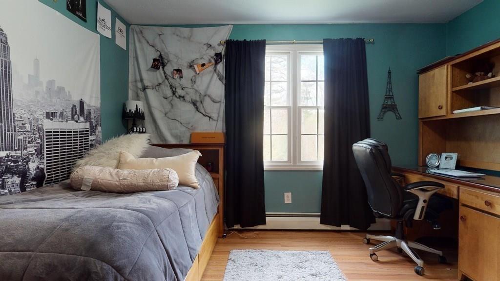 98 Haggerty Road Charlton, MA 01507 - Photo 29 of 42 a bedroom with a large bed and a window