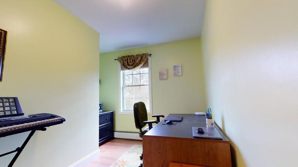 98 Haggerty Road Charlton, MA 01507 - Photo 30 of 42 a view of a workspace with furniture and a window