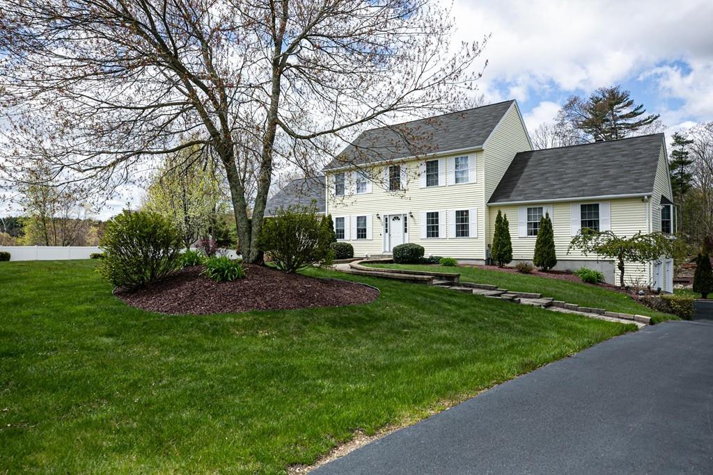98 Haggerty Road Charlton, MA 01507 - Photo 3 of 42 a front view of a house with a yard and trees