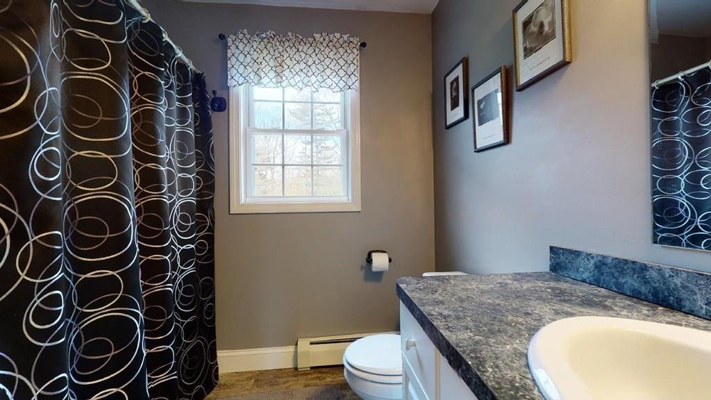 98 Haggerty Road Charlton, MA 01507 - Photo 31 of 42 a bathroom with a granite countertop sink and a toilet