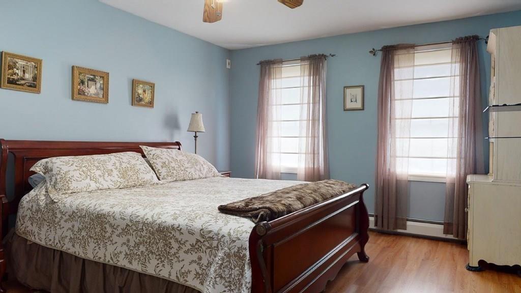 98 Haggerty Road Charlton, MA 01507 - Photo 32 of 42 a bed sitting in a bedroom next to a window