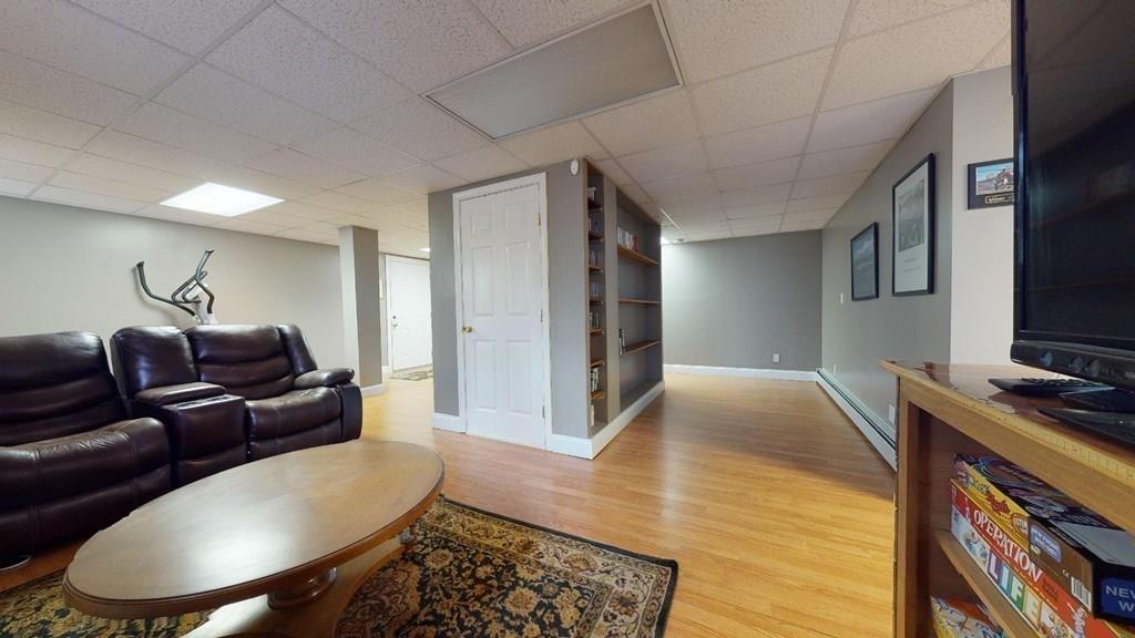 98 Haggerty Road Charlton, MA 01507 - Photo 34 of 42 a living room with furniture and a flat screen tv