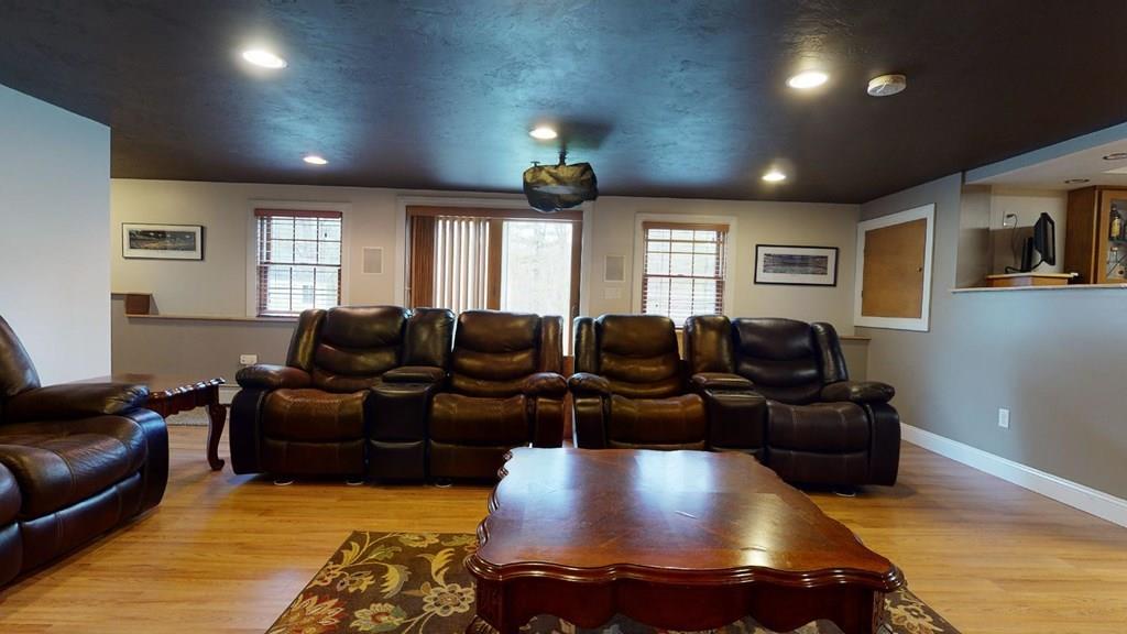 98 Haggerty Road Charlton, MA 01507 - Photo 36 of 42 a living room with furniture and a flat screen tv