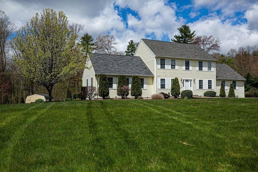 98 Haggerty Road Charlton, MA 01507 - Photo 39 of 42 a front view of a house with a garden