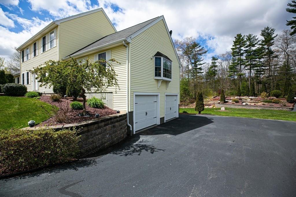 98 Haggerty Road Charlton, MA 01507 - Photo 40 of 42 a house view with a garden space