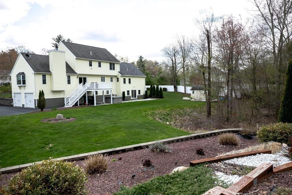 98 Haggerty Road Charlton, MA 01507 - Photo 42 of 42 a view of a house with a yard and sitting area