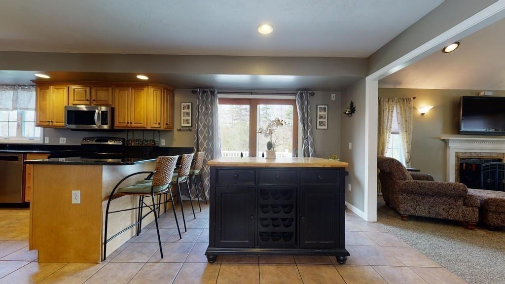 98 Haggerty Road Charlton, MA 01507 - Photo 6 of 42 a kitchen with a sink appliances and cabinets