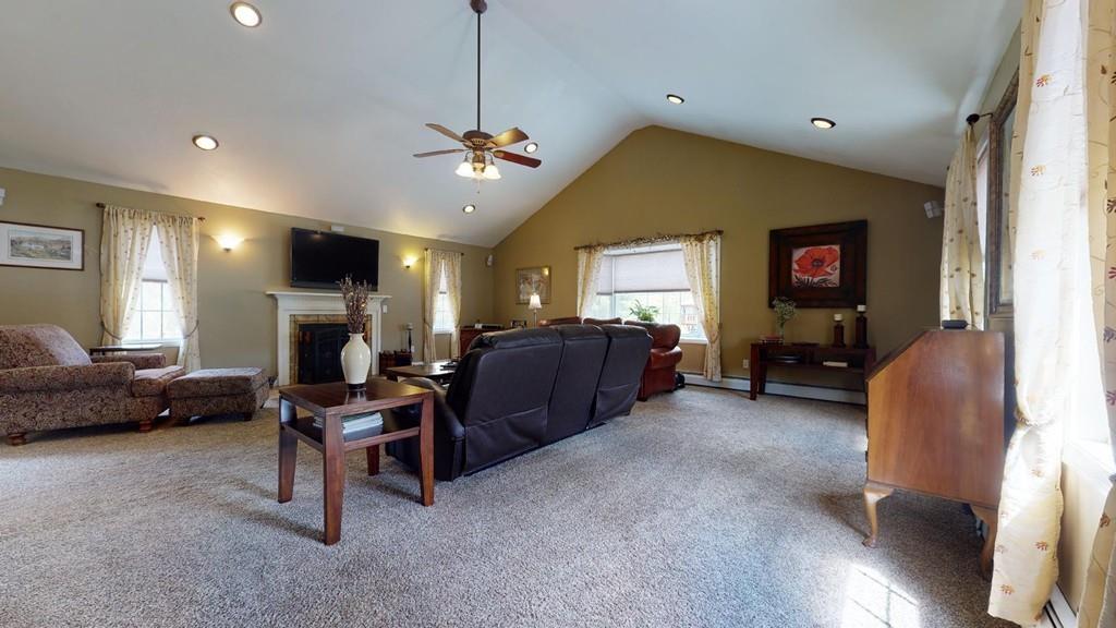 98 Haggerty Road Charlton, MA 01507 - Photo 8 of 42 a living room with furniture and a flat screen tv