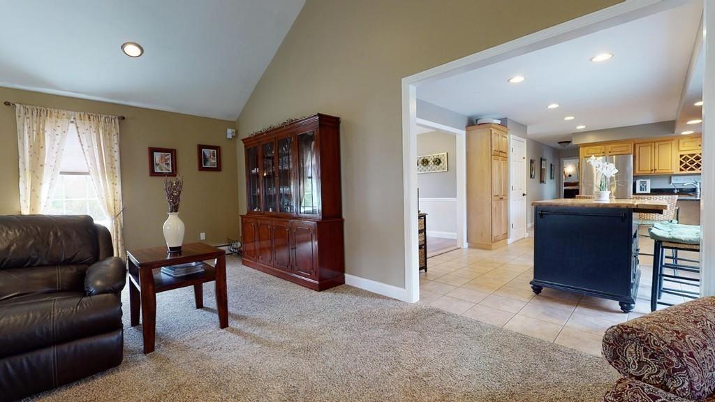 98 Haggerty Road Charlton, MA 01507 - Photo 10 of 42 a living room with furniture a dining table and kitchen view