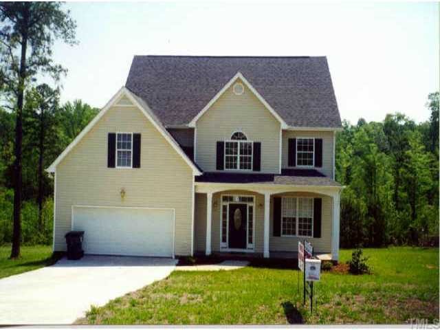 1613 Red Brick Road Garner, NC 27529 - Photo 1 of 1 a view of a yard in front of house