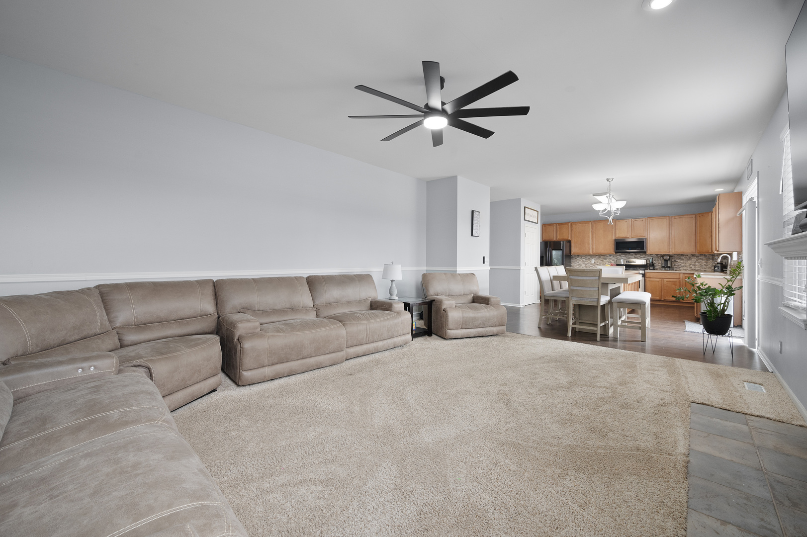 419 Riverbend Drive Genoa, IL 60135 - Photo 13 of 42 a living room with furniture and kitchen view