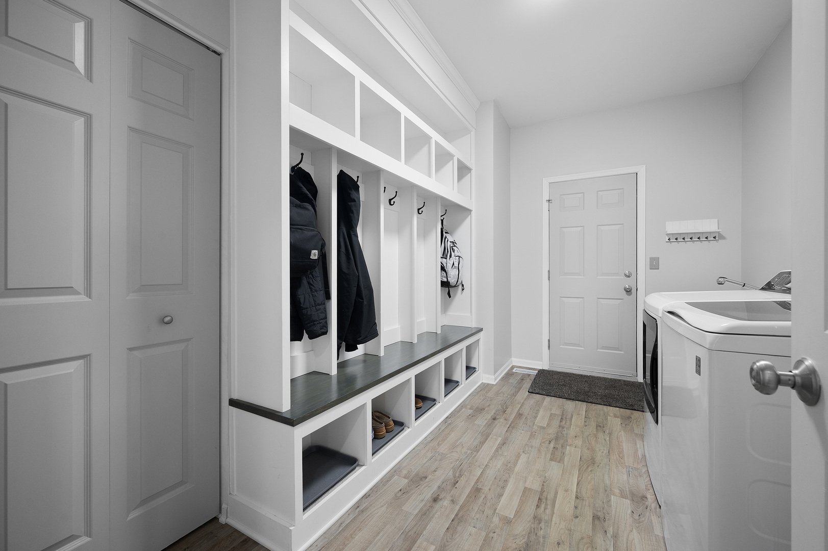 419 Riverbend Drive Genoa, IL 60135 - Photo 14 of 42 a view of a hallway with bathroom and wooden floor