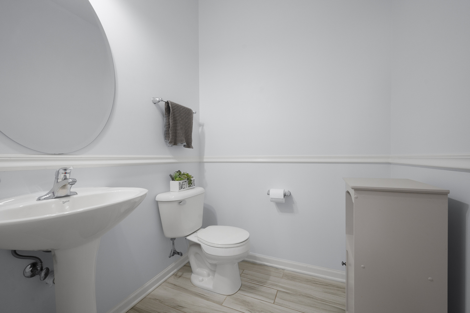 419 Riverbend Drive Genoa, IL 60135 - Photo 15 of 42 a bathroom with a toilet a sink and mirror