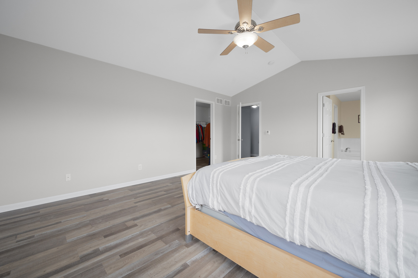 419 Riverbend Drive Genoa, IL 60135 - Photo 17 of 42 a bedroom with a bed and a ceiling fan