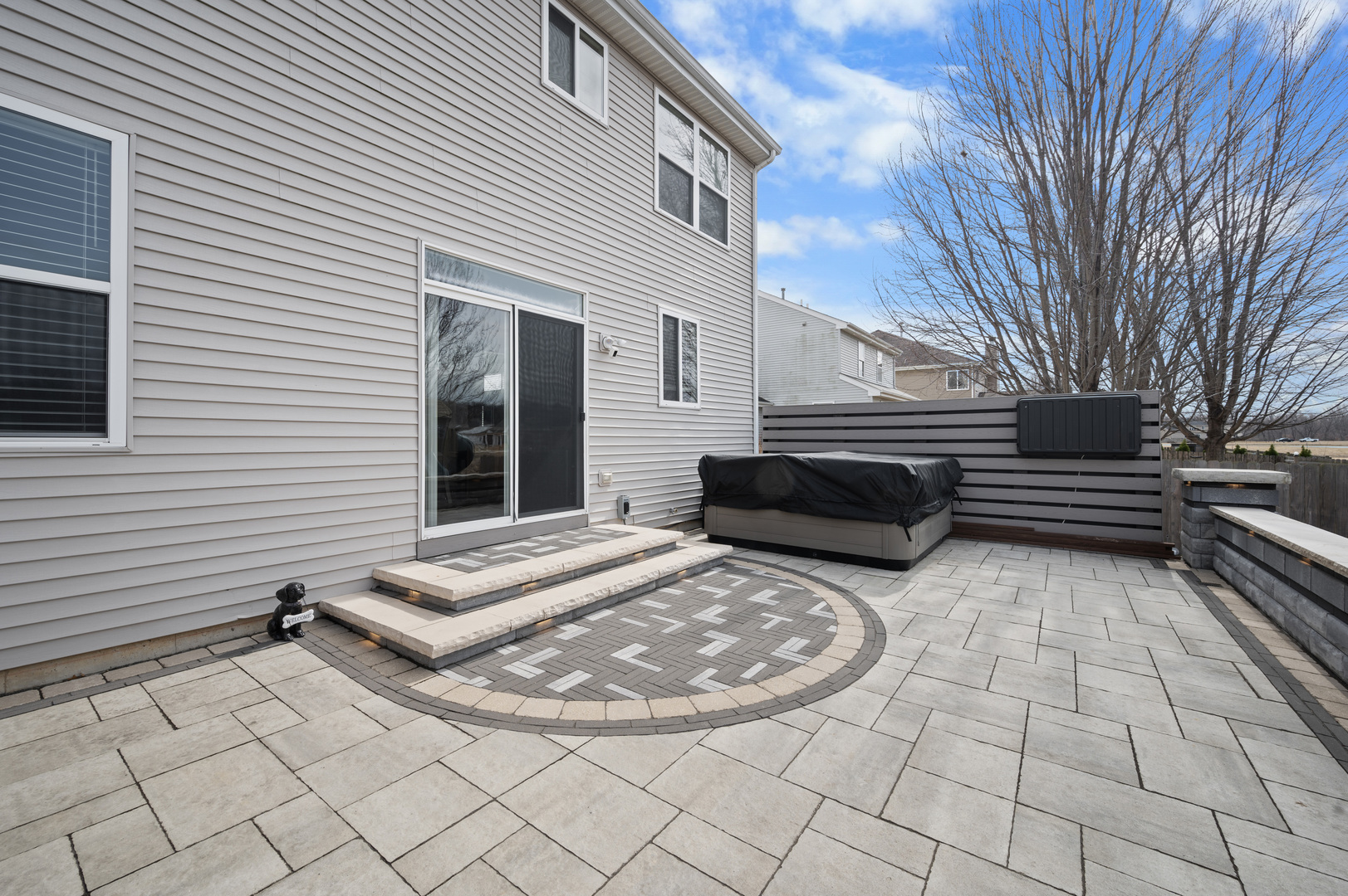 419 Riverbend Drive Genoa, IL 60135 - Photo 32 of 42 a view of a terrace with chairs and a barbeque