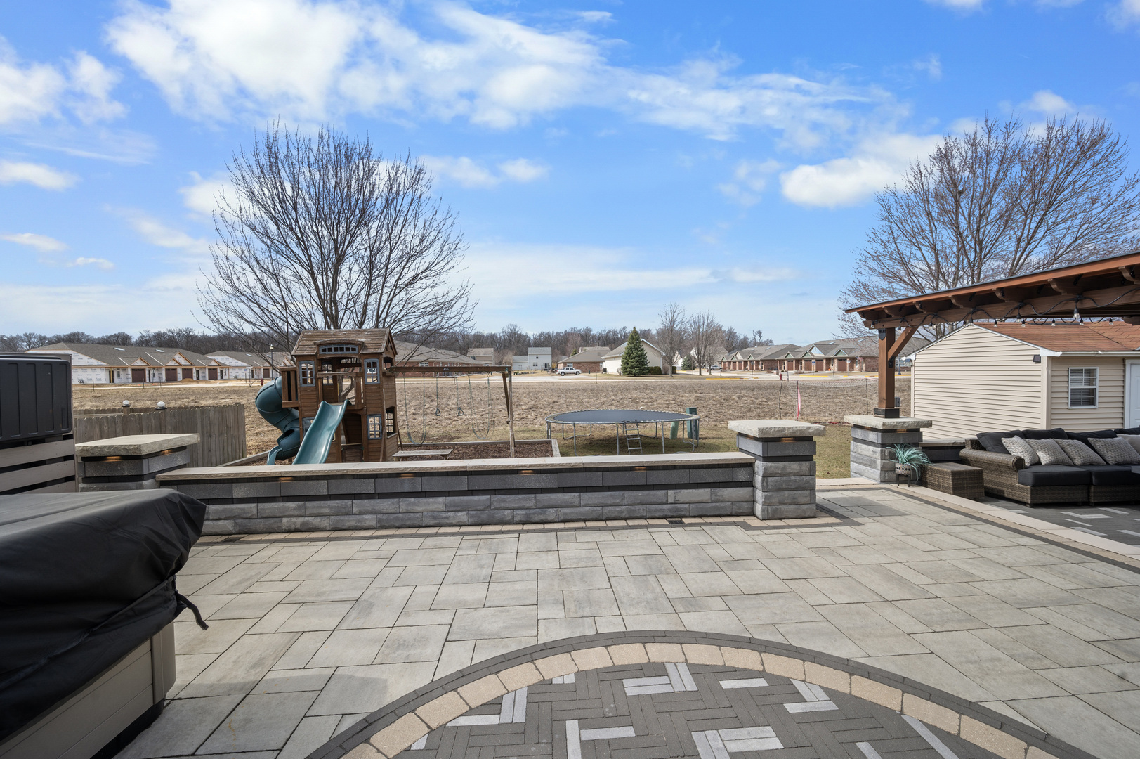 419 Riverbend Drive Genoa, IL 60135 - Photo 35 of 42 a view of a roof deck with couches and potted plants