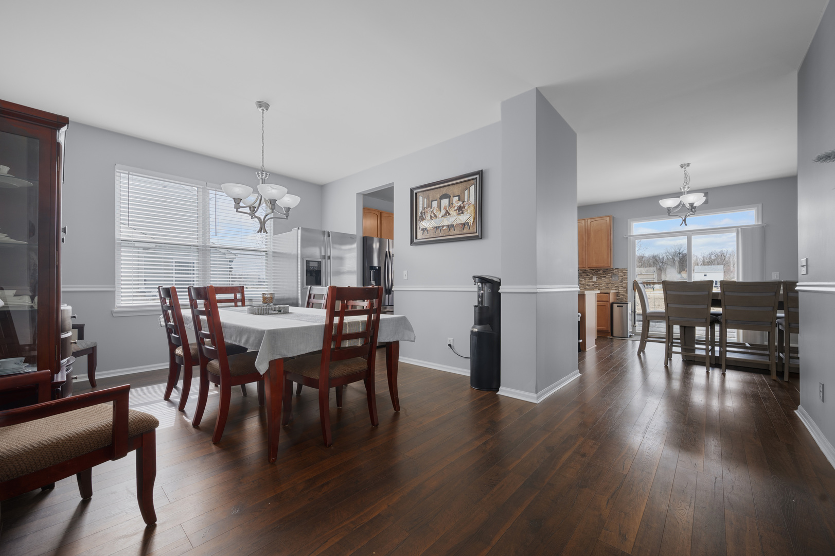 419 Riverbend Drive Genoa, IL 60135 - Photo 5 of 42 a view of a dining room with furniture wooden floor and chandelier