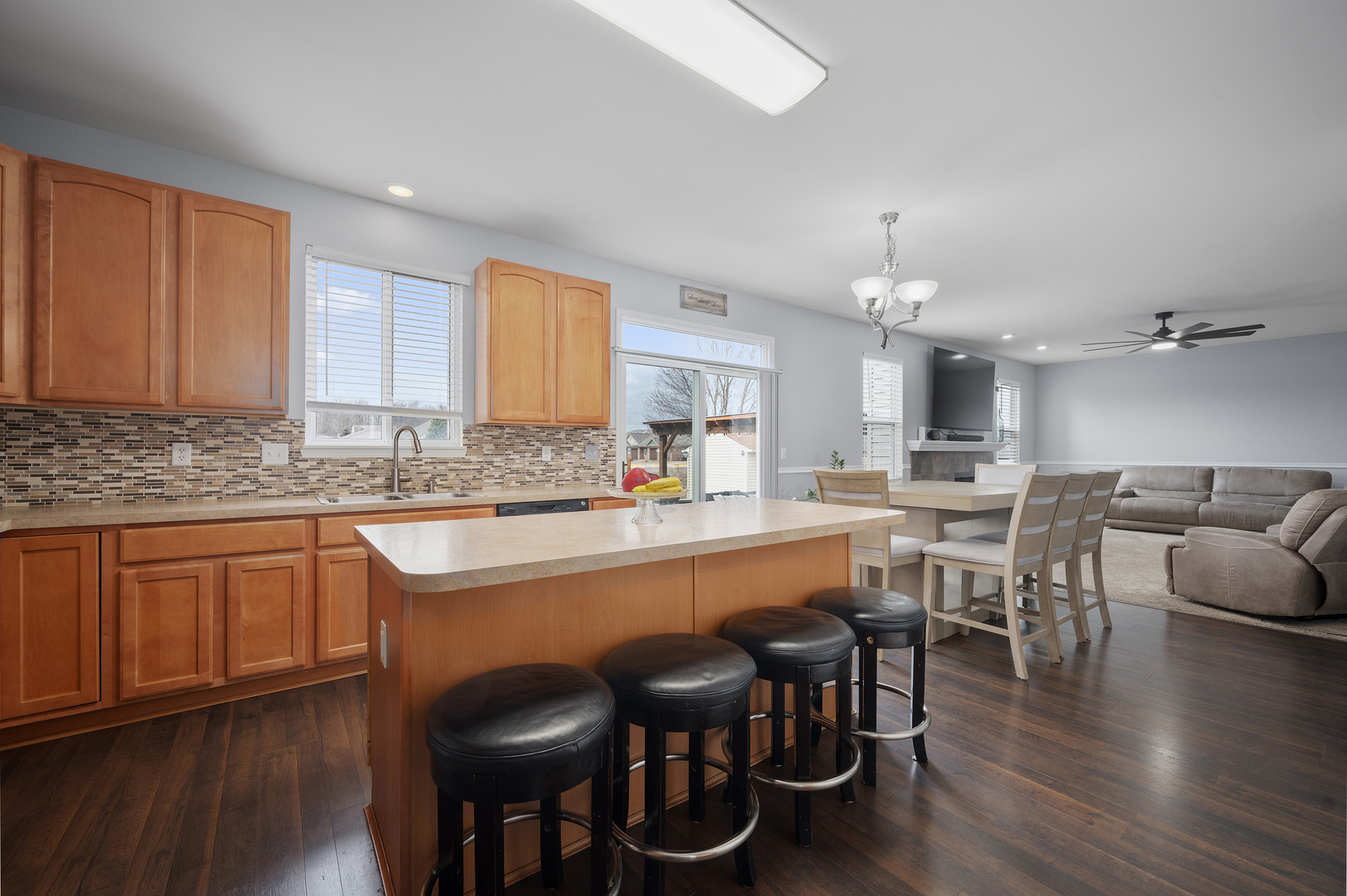 419 Riverbend Drive Genoa, IL 60135 - Photo 8 of 42 a large kitchen with a table and chairs