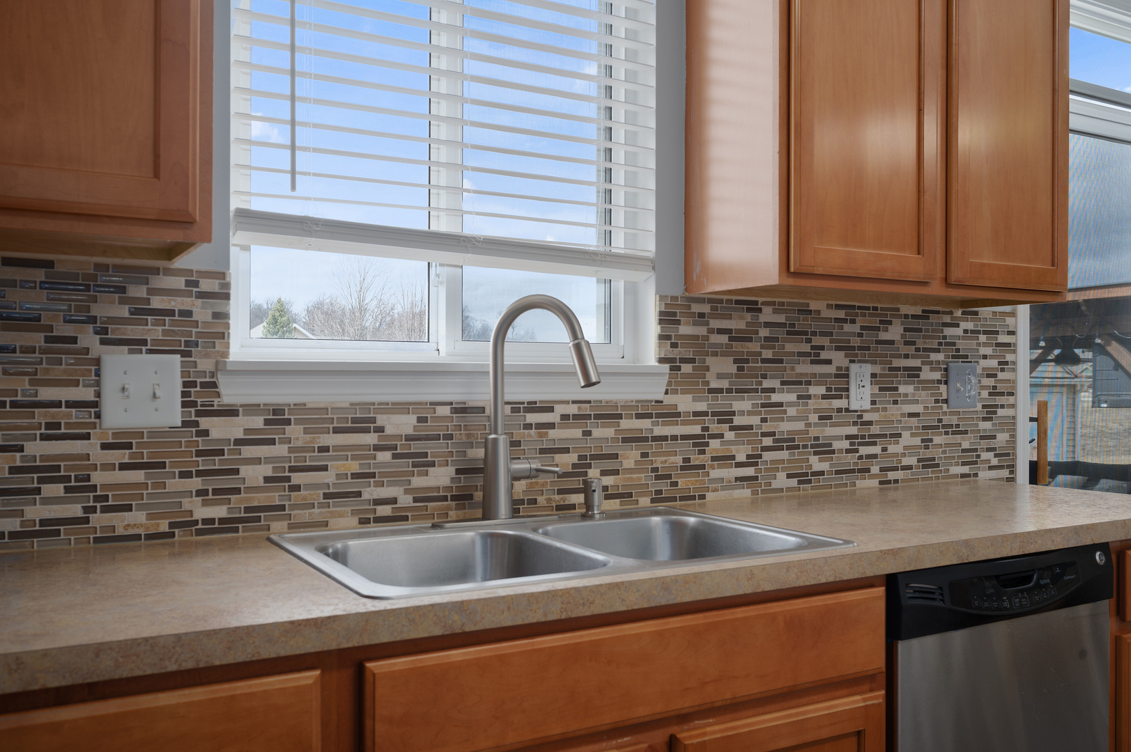 419 Riverbend Drive Genoa, IL 60135 - Photo 10 of 42 a kitchen with a sink and a window