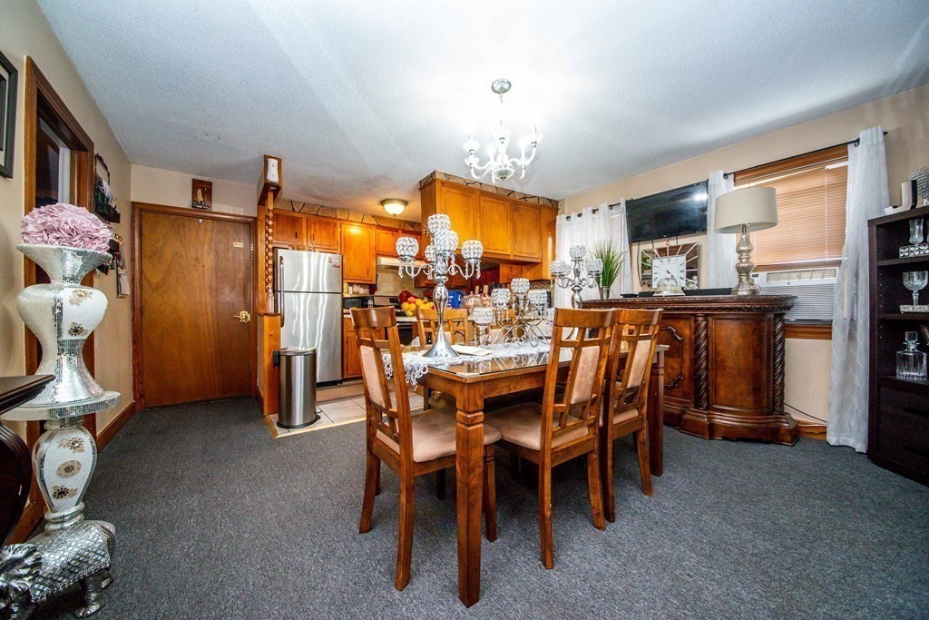 328 Broadway Fall River, MA 02721 - Photo 19 of 29 a dining room with furniture and window