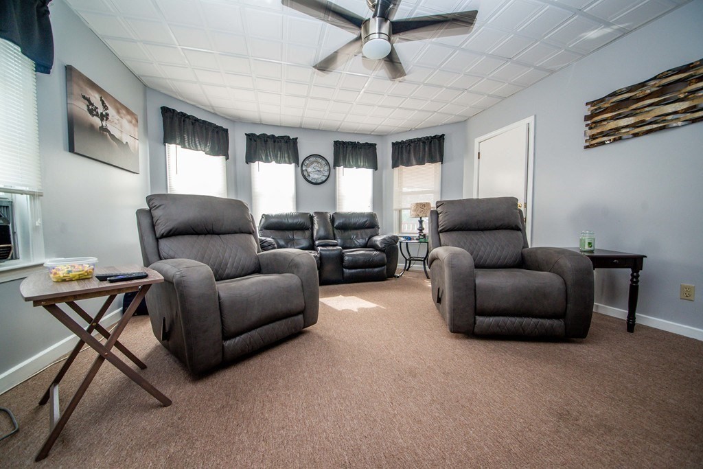 328 Broadway Fall River, MA 02721 - Photo 8 of 29 a living room with furniture and a ceiling fan