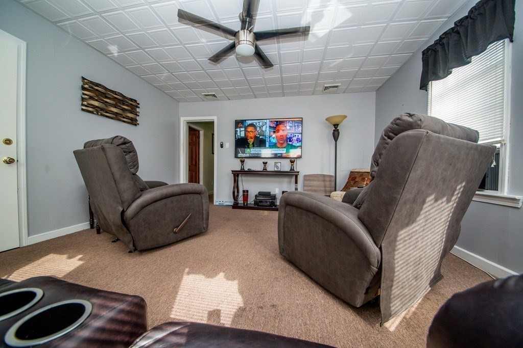 328 Broadway Fall River, MA 02721 - Photo 9 of 29 a living room with furniture and a flat screen tv