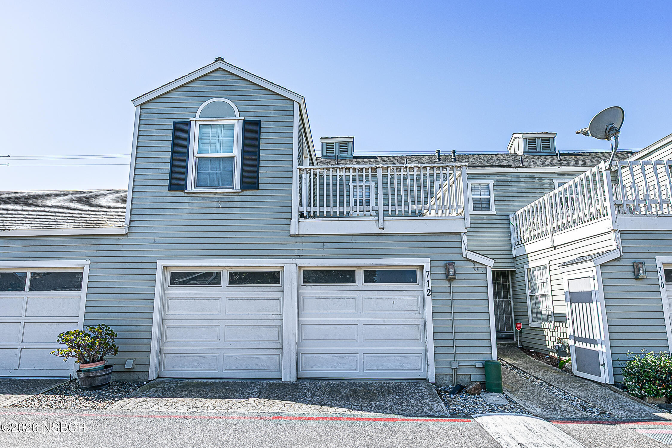 712 Pebble Beach Place Santa Maria, CA 93454 - Photo 1 of 31 a front view of a house with a yard and garage