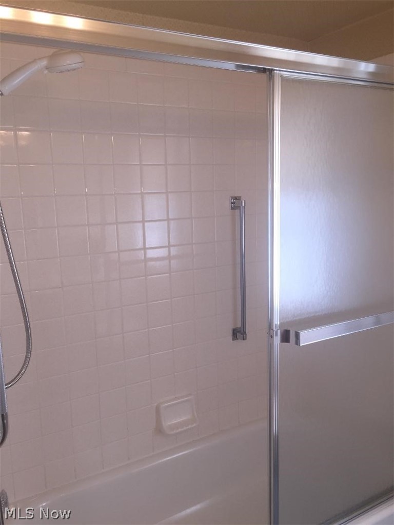 13812 Granger Road Cleveland, OH 44125 - Photo 7 of 29 Beautifully finished full shower/tub combination w/sliding doors.