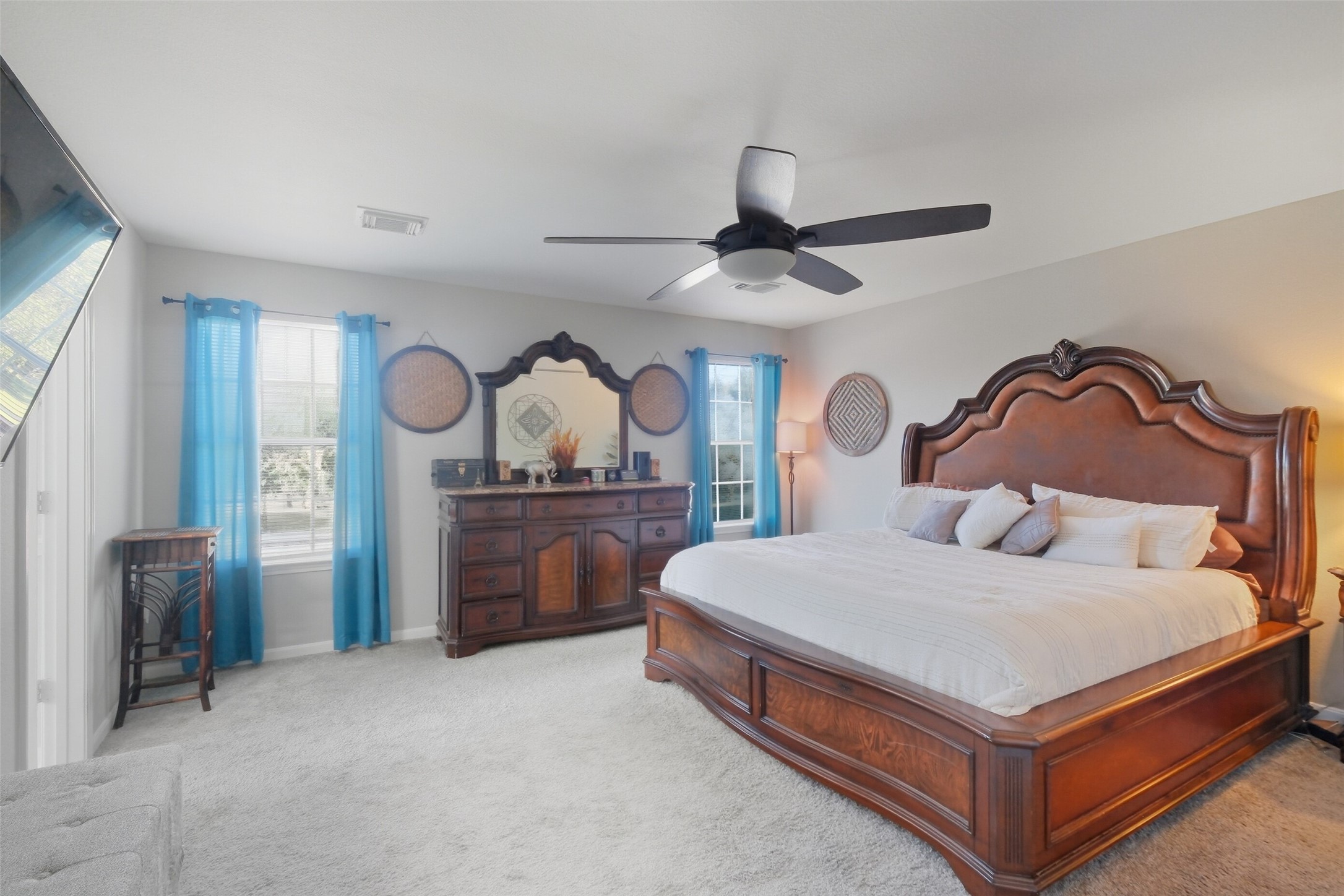 2934 Valiant Scene Court Houston, TX 77038 - Photo 12 of 28 a bedroom with a bed and a chandelier