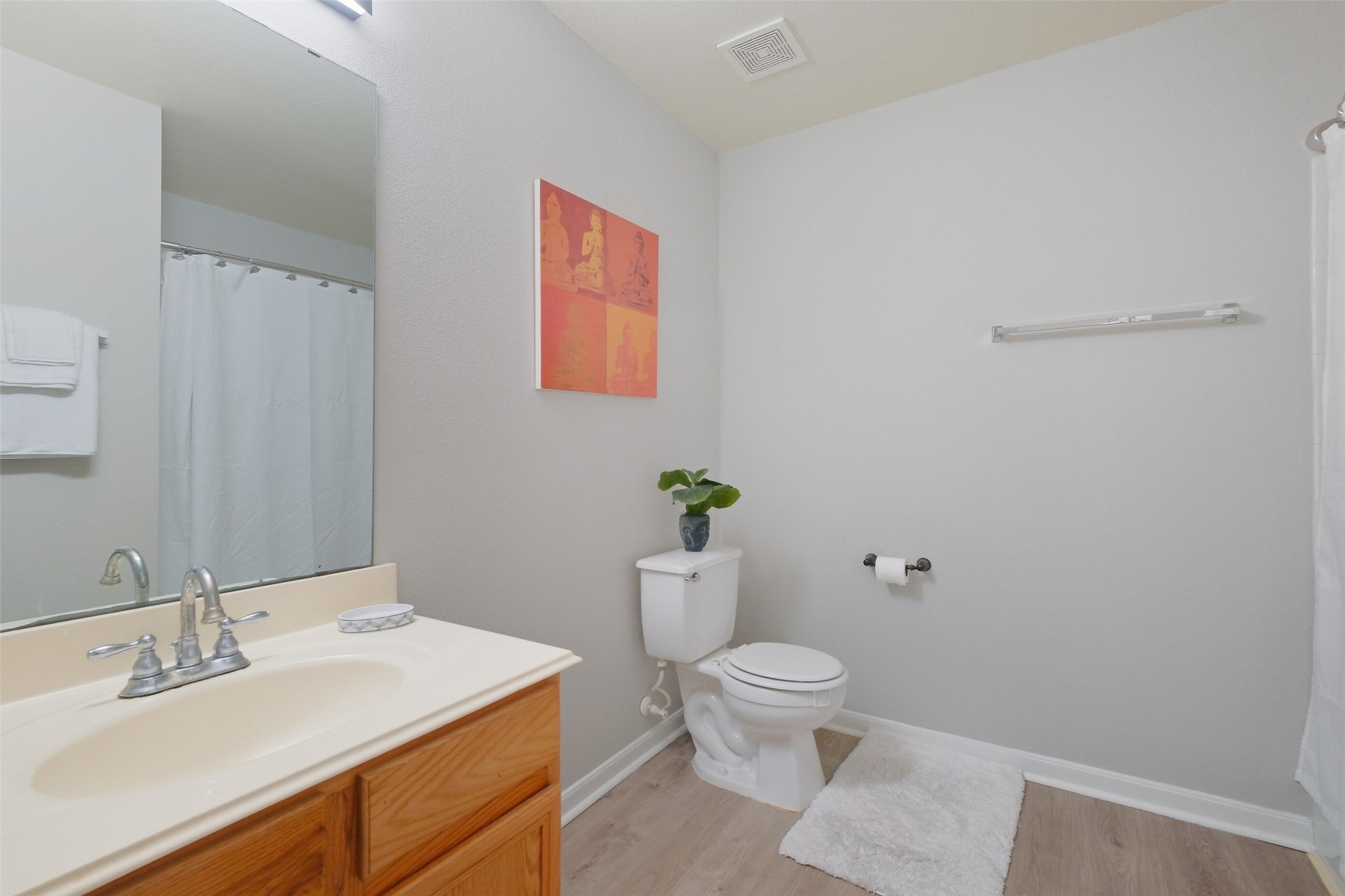 2934 Valiant Scene Court Houston, TX 77038 - Photo 21 of 28 a bathroom with a toilet sink and mirror