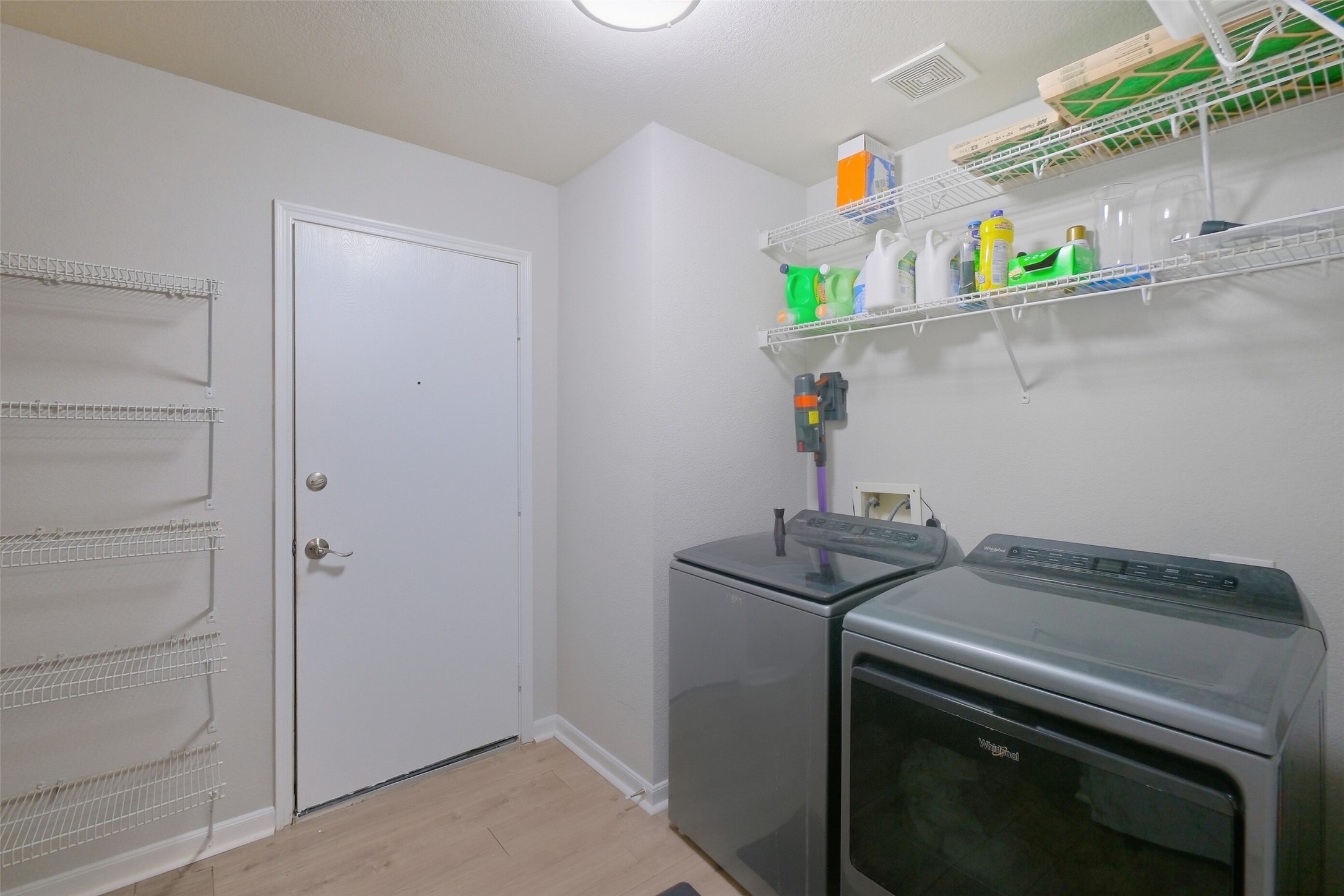2934 Valiant Scene Court Houston, TX 77038 - Photo 23 of 28 a kitchen with a microwave and a stove