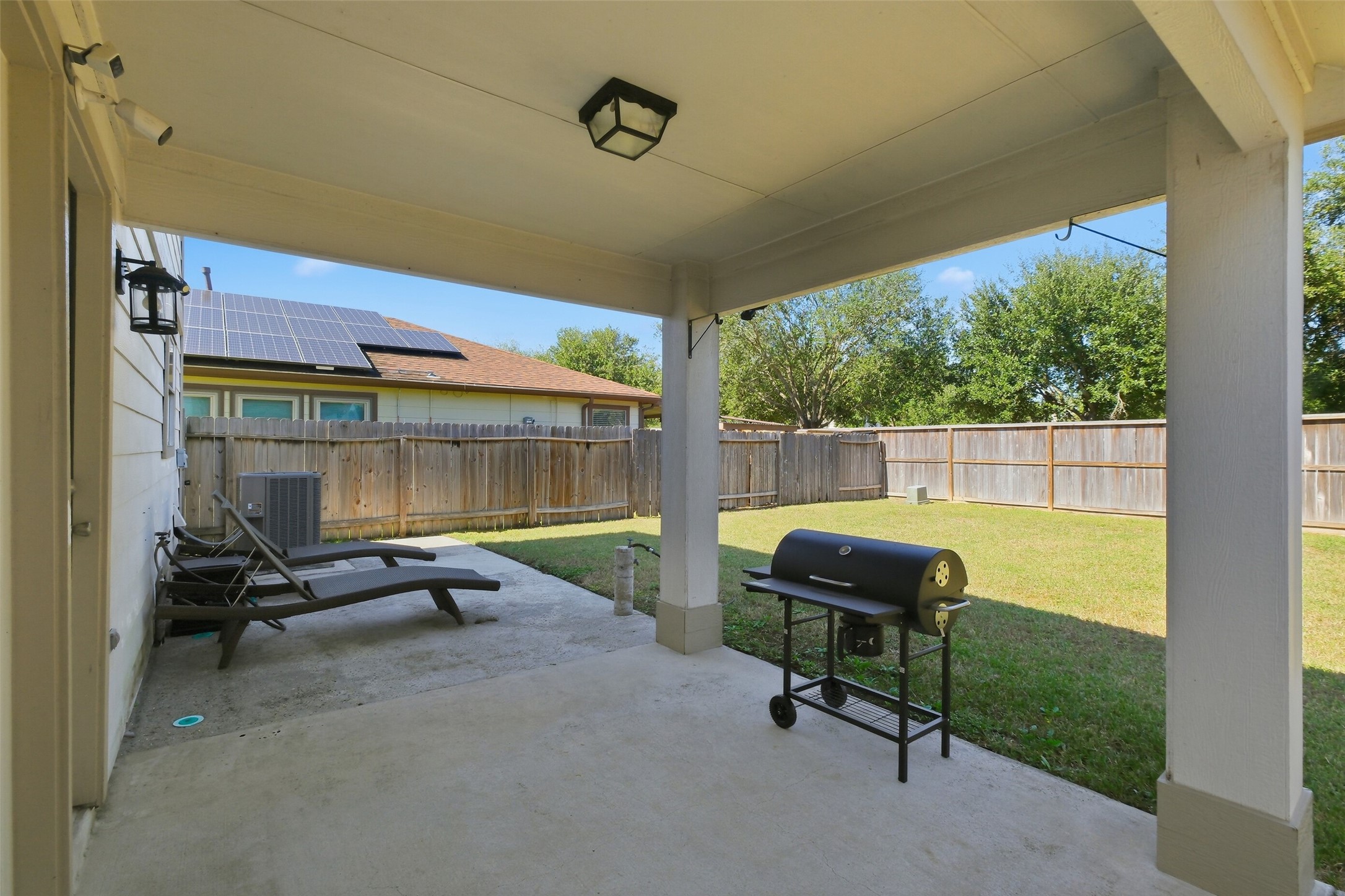 2934 Valiant Scene Court Houston, TX 77038 - Photo 25 of 28 a living room with furniture and a floor to ceiling window