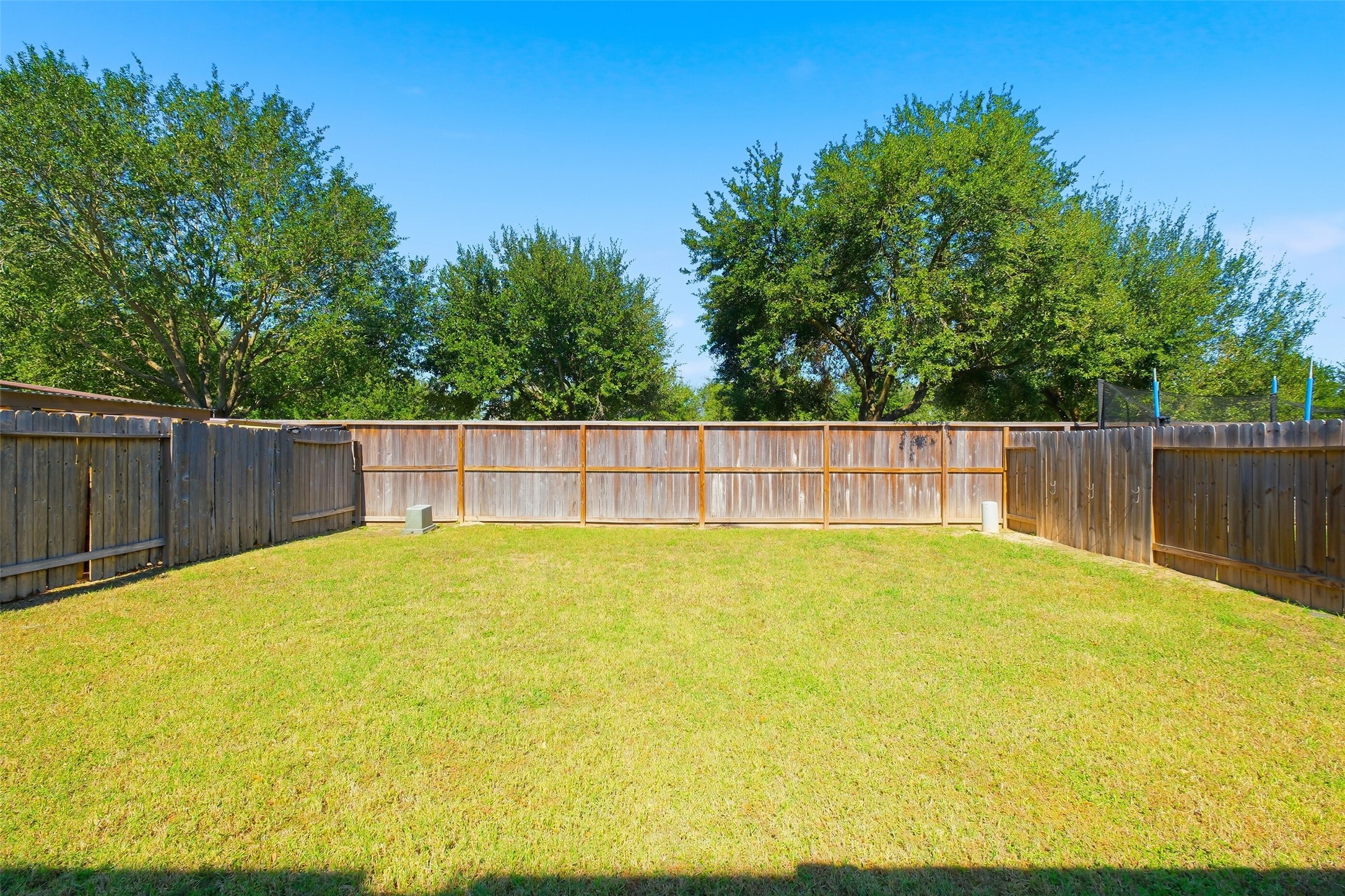 2934 Valiant Scene Court Houston, TX 77038 - Photo 28 of 28 a swimming pool with wooden fence