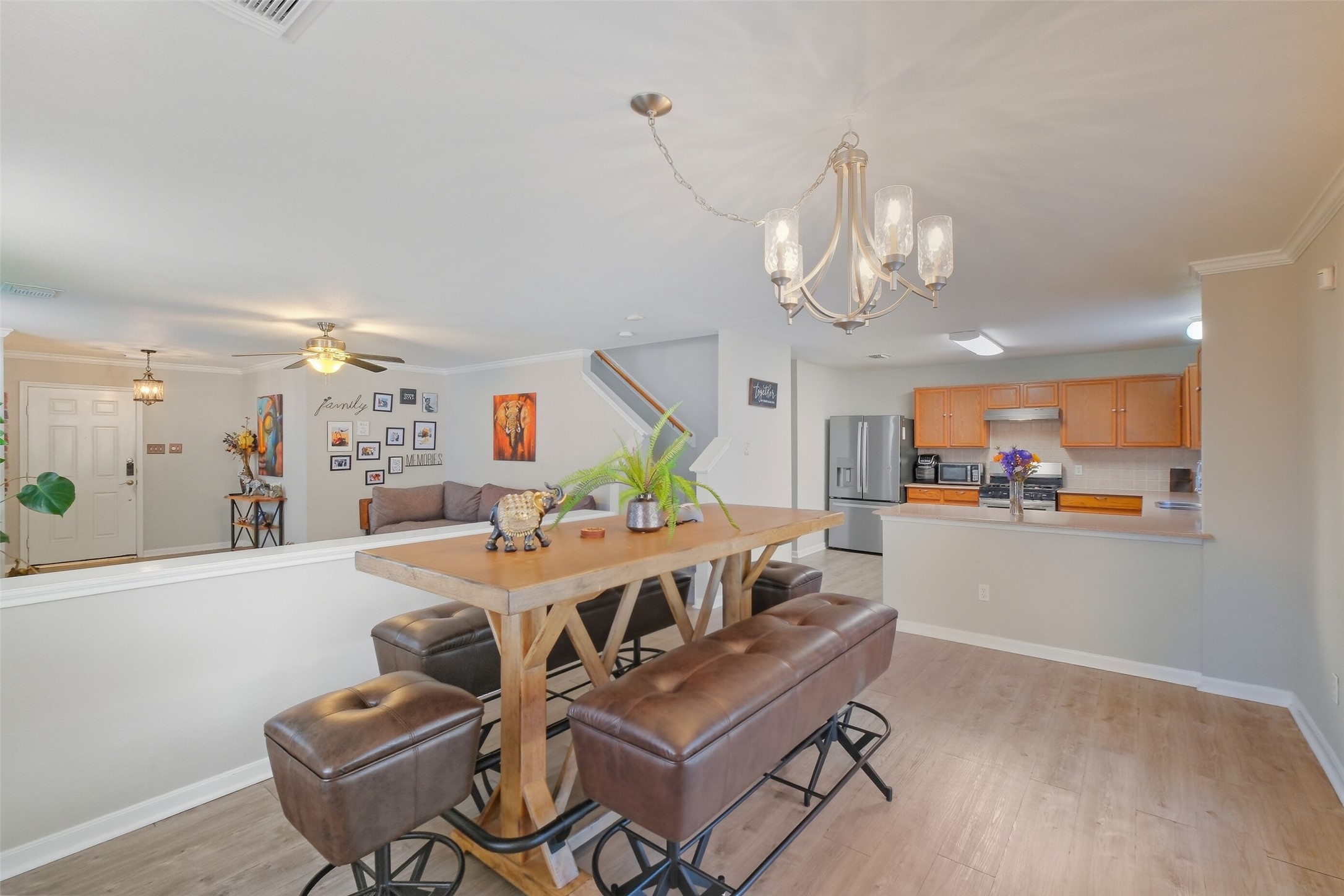 2934 Valiant Scene Court Houston, TX 77038 - Photo 8 of 28 a view of a dining room with furniture and a chandelier