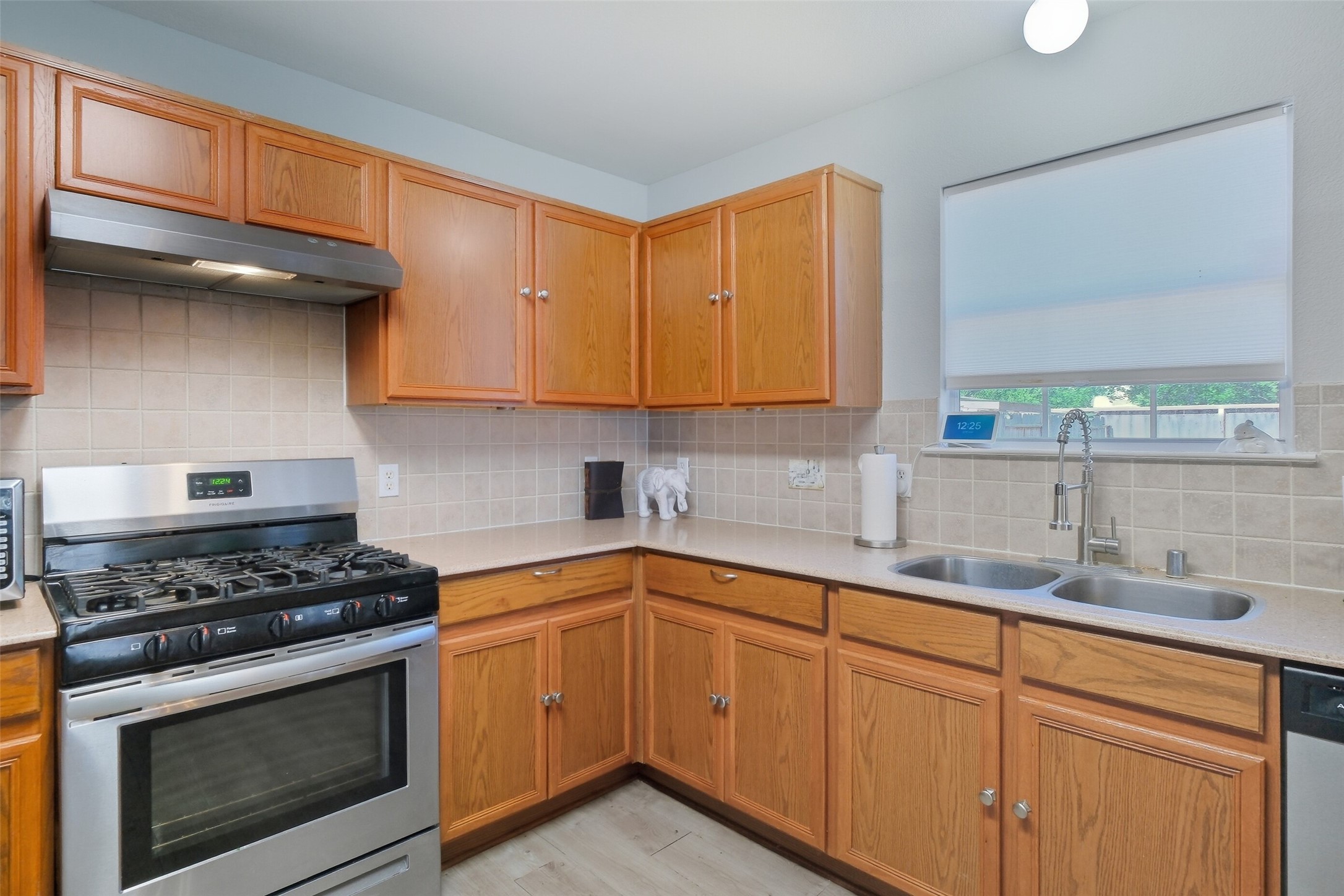 2934 Valiant Scene Court Houston, TX 77038 - Photo 9 of 28 a kitchen with stainless steel appliances granite countertop a sink a stove and a microwave
