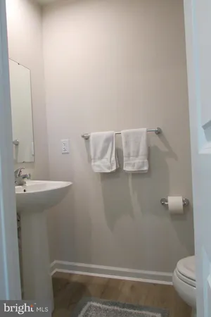 a bathroom with a granite countertop sink